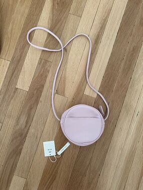 Urban Outfitters light purple round circle purse